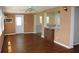Living room with wood-look flooring and access to the kitchen at 4251 100Th N Ave # 2, Pinellas Park, FL 33782