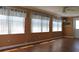Living room with laminate flooring and window coverings at 4251 100Th N Ave # 2, Pinellas Park, FL 33782