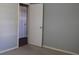 Bedroom with door to another room and light grey walls at 4251 100Th N Ave # 2, Pinellas Park, FL 33782