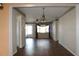 Spacious dining room with hardwood floors and a chandelier at 4251 100Th N Ave # 2, Pinellas Park, FL 33782