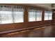 Spacious living room with multiple windows and laminate flooring at 4251 100Th N Ave # 2, Pinellas Park, FL 33782