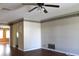 Bright living room featuring hardwood floors and a ceiling fan at 4251 100Th N Ave # 2, Pinellas Park, FL 33782
