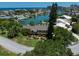 Waterfront home with lush landscaping at 309 Belle Isle Ave, Belleair Beach, FL 33786