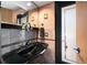 Stylish bathroom with black sink and vanity at 309 Belle Isle Ave, Belleair Beach, FL 33786
