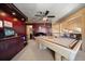 Game room with pool table and built-in cabinets at 309 Belle Isle Ave, Belleair Beach, FL 33786