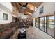 Bright living room with water views and sliding glass doors at 309 Belle Isle Ave, Belleair Beach, FL 33786
