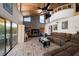 Spacious living room with vaulted ceilings, fireplace, and large windows at 309 Belle Isle Ave, Belleair Beach, FL 33786