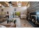 Open concept living area with fireplace, bar, and access to patio at 309 Belle Isle Ave, Belleair Beach, FL 33786