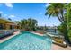 Relaxing kidney-shaped pool with spa and water access at 309 Belle Isle Ave, Belleair Beach, FL 33786