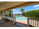 Inviting pool area with canal views and lush landscaping at 309 Belle Isle Ave, Belleair Beach, FL 33786