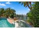 Inviting pool with spa and water views at 309 Belle Isle Ave, Belleair Beach, FL 33786
