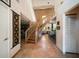 Stunning curved staircase with glass railings and wood accents at 309 Belle Isle Ave, Belleair Beach, FL 33786