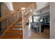 Elegant curved staircase overlooking living area and bar at 309 Belle Isle Ave, Belleair Beach, FL 33786