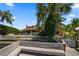 Home's rear elevation with private dock and canal access at 309 Belle Isle Ave, Belleair Beach, FL 33786
