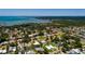 Beautiful home near the water featuring a metal roof, a wide green lawn, and a long paved driveway at 3931 38Th S Way, St Petersburg, FL 33711
