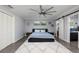 Comfortable bedroom features a large bed, stylish decor, and an en-suite bathroom at 3931 38Th S Way, St Petersburg, FL 33711