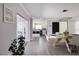 Open-concept dining area with modern lighting and access to a sleek, white kitchen at 3931 38Th S Way, St Petersburg, FL 33711