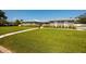 Beautiful home featuring a metal roof, an American flag, and a lush front lawn at 3931 38Th S Way, St Petersburg, FL 33711