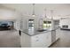 Modern kitchen featuring a large island, stainless steel appliances, and an open layout at 3931 38Th S Way, St Petersburg, FL 33711