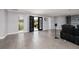 Bright living room featuring tile floors, black double doors, and neutral paint at 3931 38Th S Way, St Petersburg, FL 33711