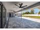 Spacious covered patio features ceiling fans, tile flooring, and ample room for outdoor entertaining at 3931 38Th S Way, St Petersburg, FL 33711