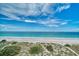 Scenic beach view with tranquil waters and blue skies at 309 Belle Isle Ave, Belleair Beach, FL 33786