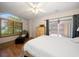 Main bedroom with water views and access to private patio at 309 Belle Isle Ave, Belleair Beach, FL 33786
