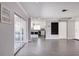 Living area with sliding doors leading to backyard and kitchen views at 3931 38Th S Way, St Petersburg, FL 33711