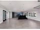 Open living area with tile floors and home theater setup at 3931 38Th S Way, St Petersburg, FL 33711