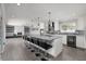 Open concept kitchen with island, seating, and stainless steel appliances at 3931 38Th S Way, St Petersburg, FL 33711