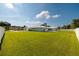 Large grassy backyard with white vinyl fence at 3931 38Th S Way, St Petersburg, FL 33711