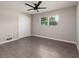 Simple bedroom with grey tile floors and white blinds at 3931 38Th S Way, St Petersburg, FL 33711