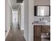 Long hallway with light grey walls and tile floors at 3931 38Th S Way, St Petersburg, FL 33711