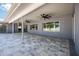 Covered patio with pavers, ceiling fans, and view of backyard at 3931 38Th S Way, St Petersburg, FL 33711
