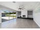 Living room with fireplace, built-in shelves, and sliding glass doors at 3931 38Th S Way, St Petersburg, FL 33711
