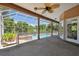Covered patio overlooking the pool and spa with ceiling fans at 6109 Waters Way, Weeki Wachee, FL 34607