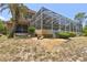 Screened-in pool and patio area in backyard at 6109 Waters Way, Weeki Wachee, FL 34607