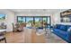 Bright living room with balcony access and ocean view at 2200 Bay Blvd # A, Indian Rocks Beach, FL 33785