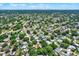 Aerial view of neighborhood with lush trees and houses at 6490 34Th N Ave, St Petersburg, FL 33710