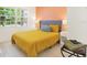 Bedroom with mustard yellow bedding and ample natural light at 6490 34Th N Ave, St Petersburg, FL 33710