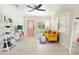 Living area showcasing a yellow sofa and modern shelving unit at 6490 34Th N Ave, St Petersburg, FL 33710