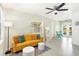 Bright living room with yellow couch and modern decor at 6490 34Th N Ave, St Petersburg, FL 33710