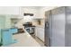 Updated kitchen with stainless steel appliances and white cabinets at 6490 34Th N Ave, St Petersburg, FL 33710