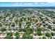 Aerial view of neighborhood with lush trees and houses at 6490 34Th N Ave, St Petersburg, FL 33710