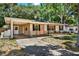 Charming ranch home with carport and well-manicured lawn at 6490 34Th N Ave, St Petersburg, FL 33710