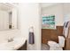 Clean bathroom with brown tile, updated vanity, and window at 6490 34Th N Ave, St Petersburg, FL 33710