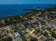 Aerial view of neighborhood, coastline, and home with new roof in central Florida at 1032 Rosetree Ln, Tarpon Springs, FL 34689