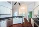 Well-appointed kitchen featuring granite countertops, stainless steel appliances, and a breakfast bar overlooking the dining area at 1032 Rosetree Ln, Tarpon Springs, FL 34689