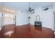Spacious living room featuring an open floor plan, beautiful wood floors, a fireplace, and stylish architectural details at 1032 Rosetree Ln, Tarpon Springs, FL 34689