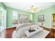 Spacious main bedroom with wood floors and access to a balcony at 1032 Rosetree Ln, Tarpon Springs, FL 34689